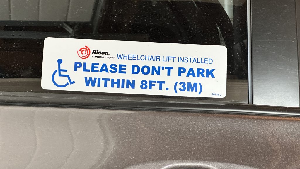 sticker on vehicle reads "please don't park within 8 feet"