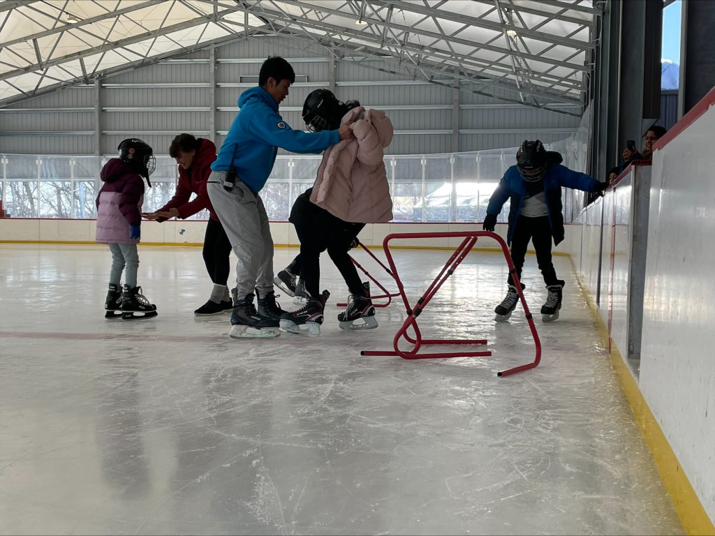 children learning to skate on rink
