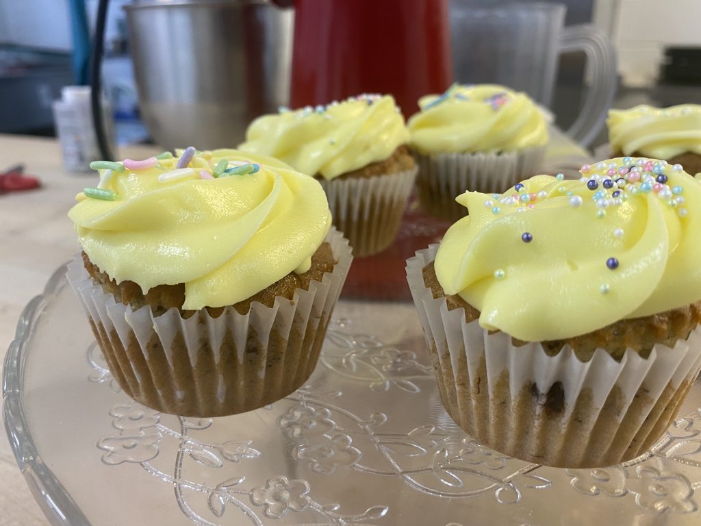 yellow-frosted cupcakes