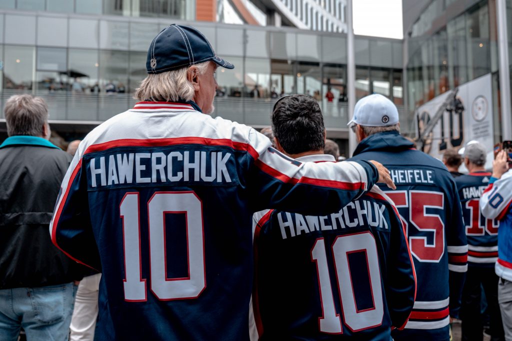 two people with hawerchuk jerseys