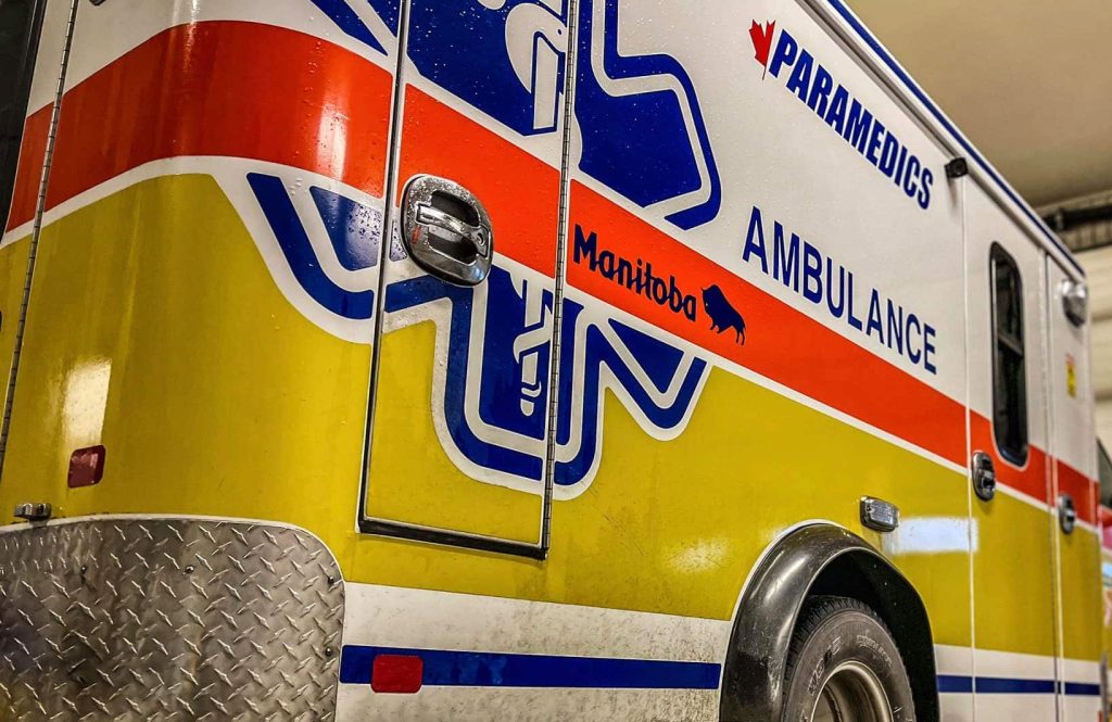 A Manitoba paramedics ambulance parked in garage