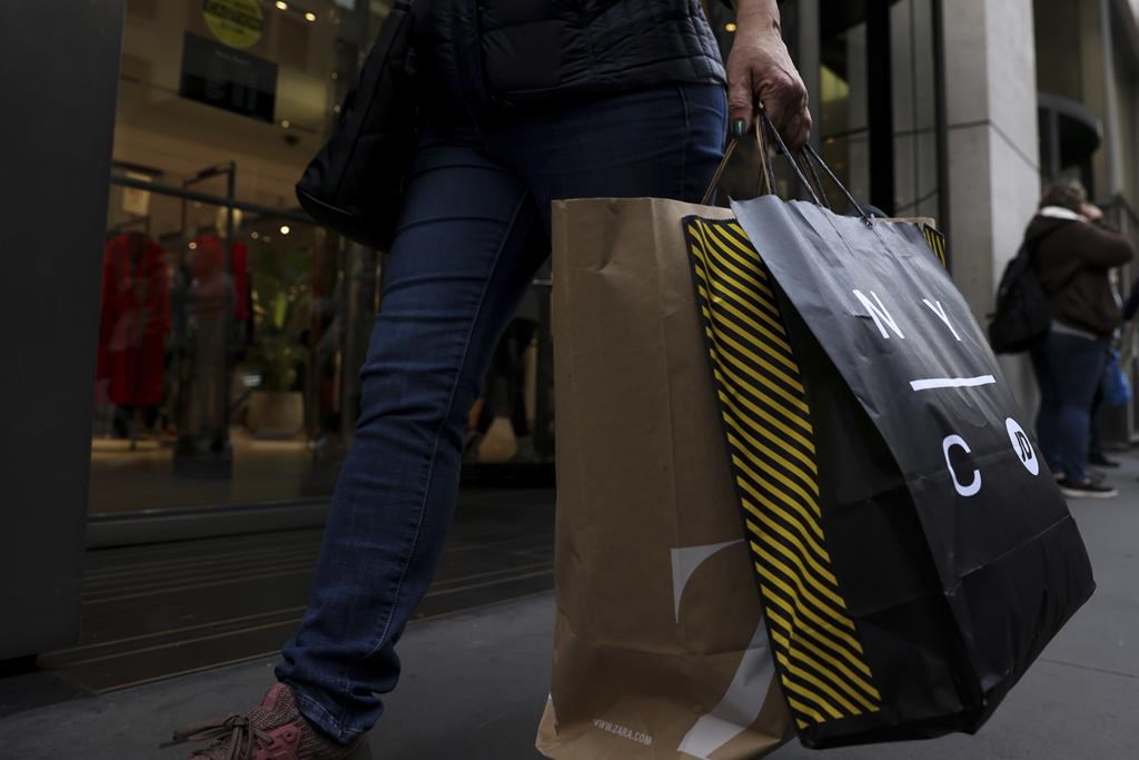 shopper holding bags