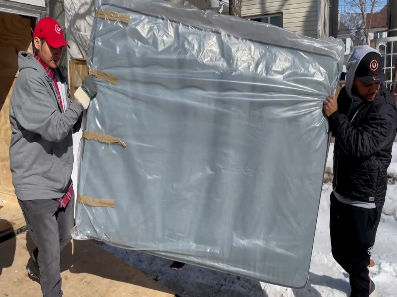 Community group provides five new mattresses to family in need