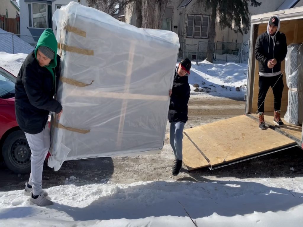 Community group provides five new mattresses to family in need